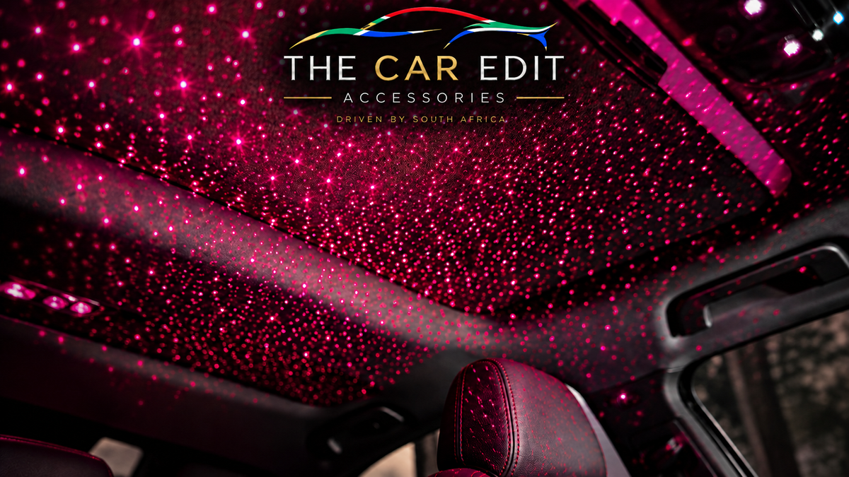 The Car Edit Starlight Charge Hub car charger on a South African flag knit, showing the 12.0V display and illuminated ports