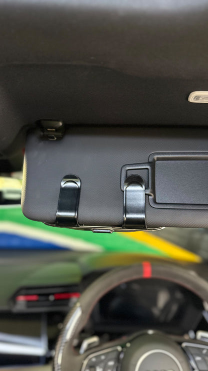 The Car Edit Carbon Case sunglasses holder with carbon-fibre finish for a car sun visor