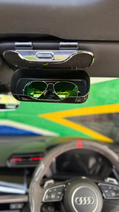 The Car Edit Carbon Case sunglasses holder with carbon-fibre finish for a car sun visor