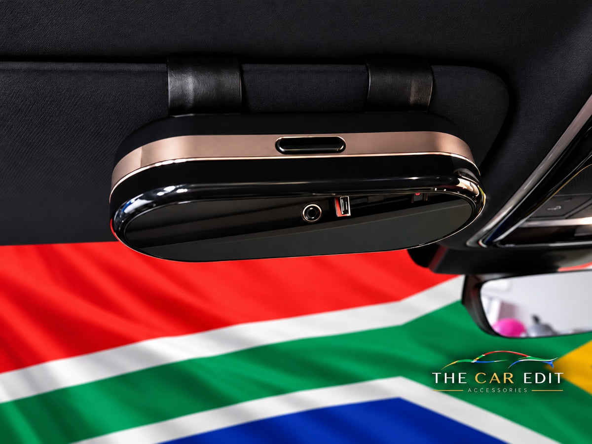 The Chrome Case in Black & Gold clipped to a car sun visor