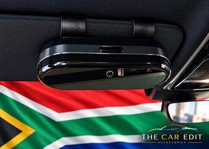 The Chrome Case sunglasses case clipped to a car sun visor, closed