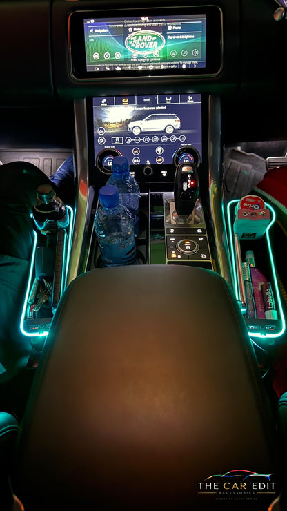 The Gap Keeper Pro pair lit teal beside the centre console