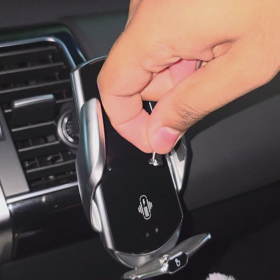 Video of GripBot's auto-clamp arms closing around a phone on a car air vent