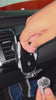 Video of GripBot's auto-clamp arms closing around a phone on a car air vent